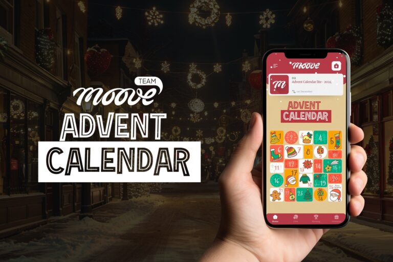 Hand holding a smartphone displaying the Mooveteam Advent Calendar app interface with colorful, festive icons representing daily challenges for December. The background features a beautifully decorated street with Christmas lights, snowflakes, and holiday ornaments, creating a warm and festive atmosphere.