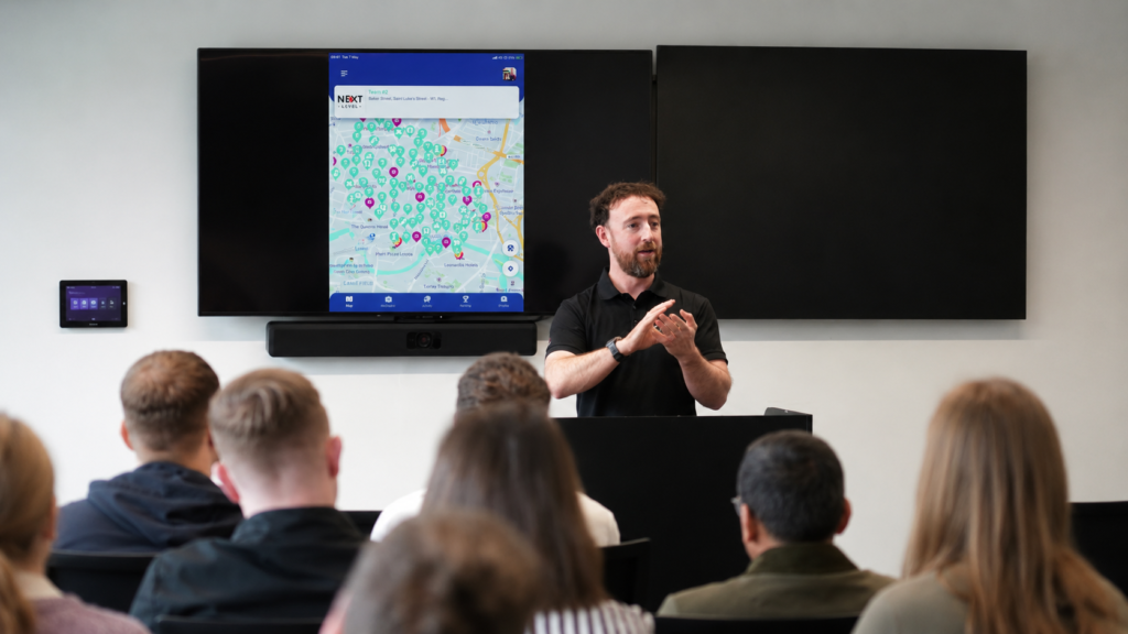 A presenter explaining the ClueGO gamification platform.